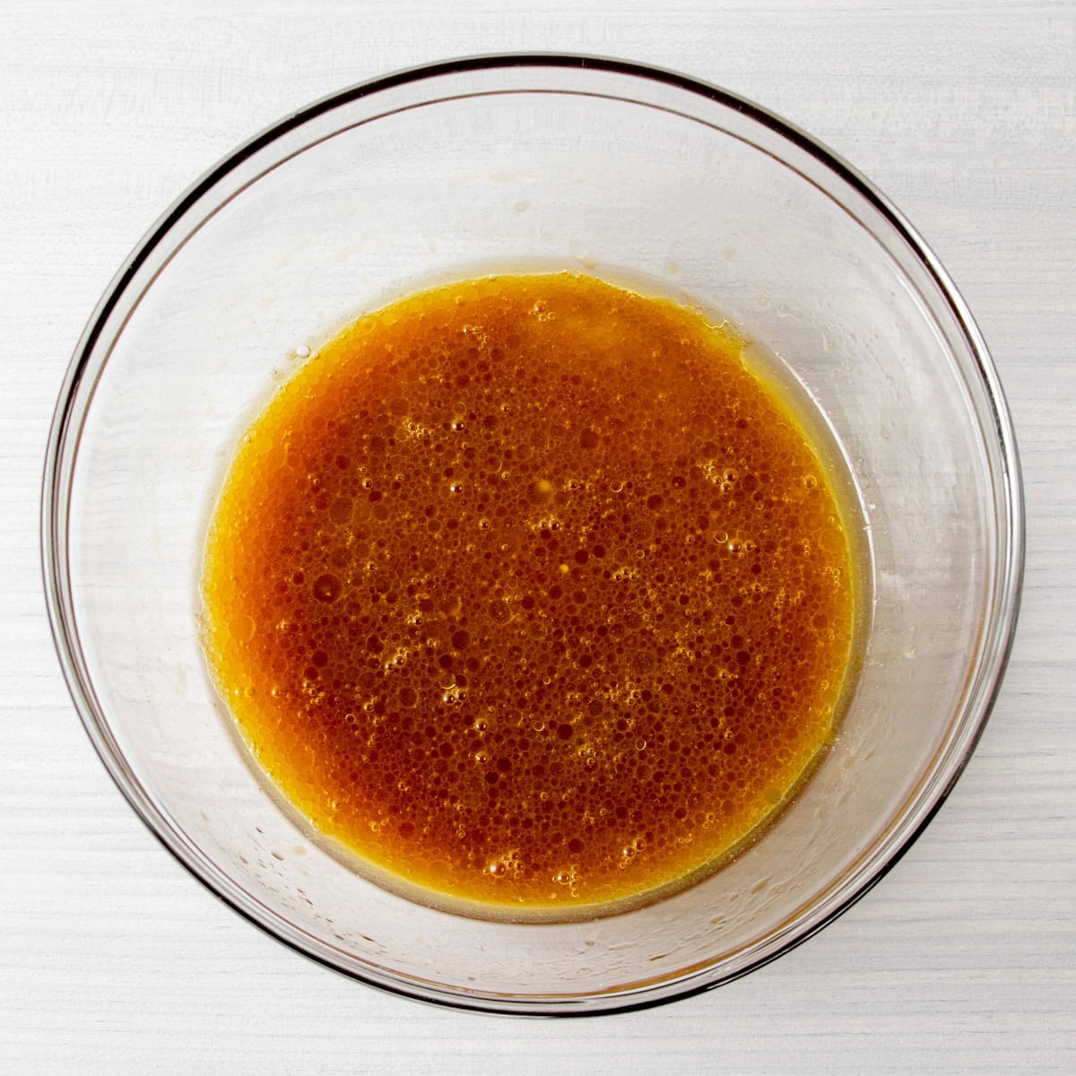 wet ingredients for collagen protein brownies mixed in a bowl.