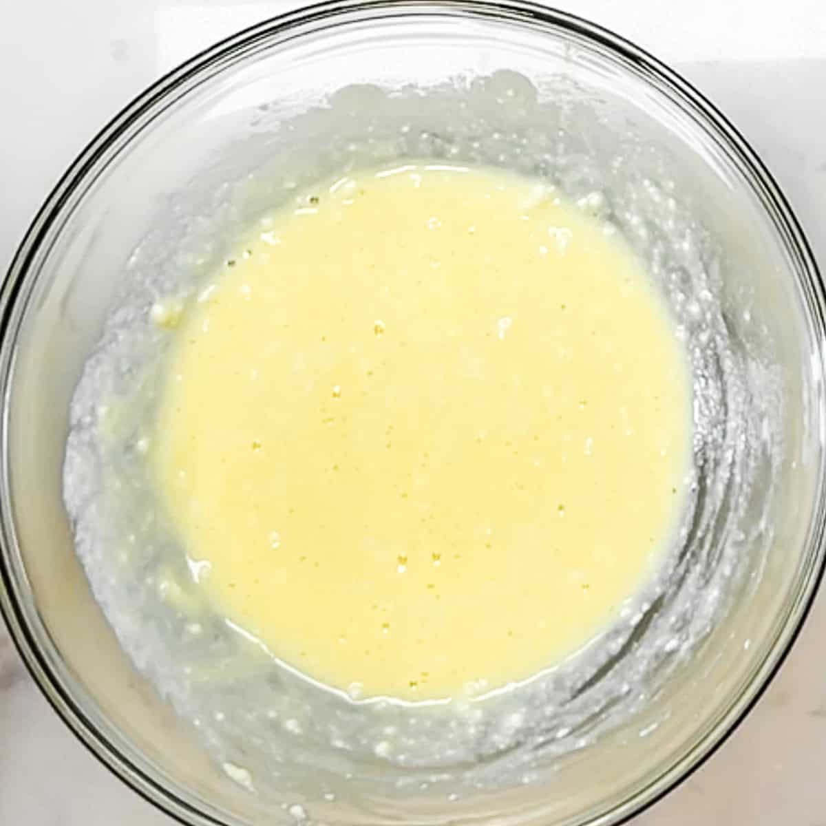 egg and ricotta mixed in a bowl.