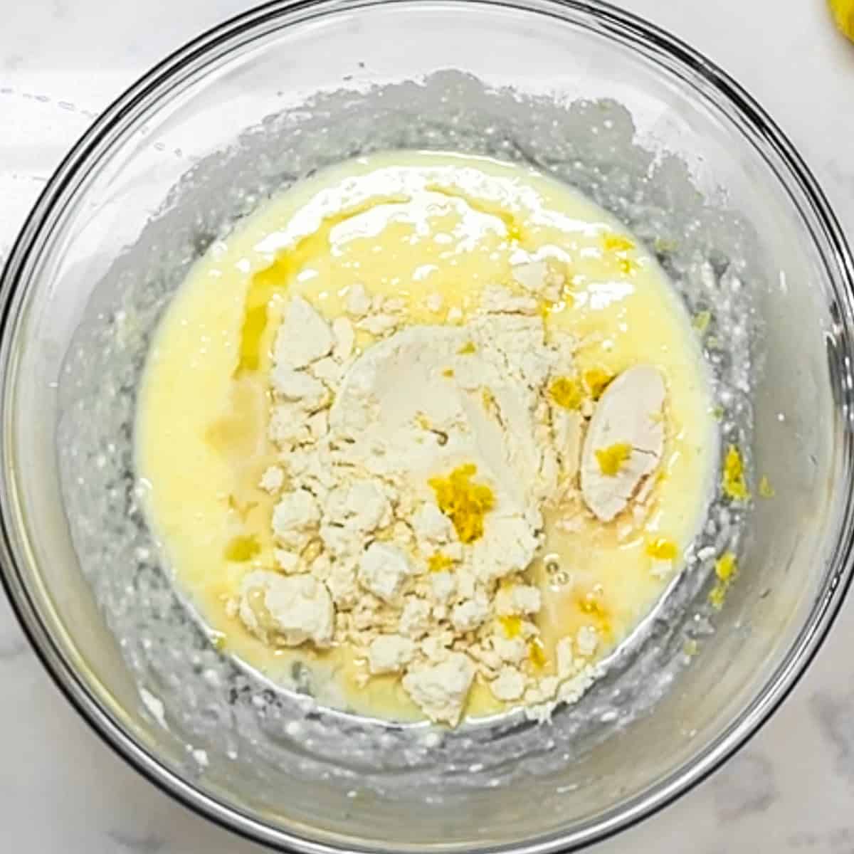 egg and ricotta mixture with protein, coconut flour, lemon juice and lemon zest added on top.