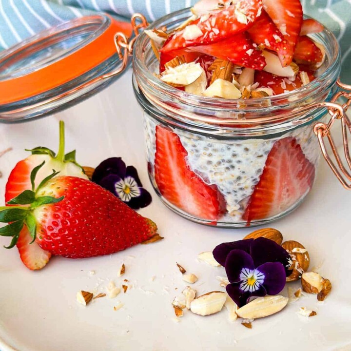 strawberry and almond protein overnight oats in a small jar.