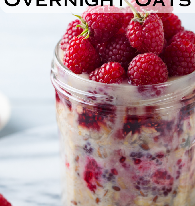 jar of overnight protein oats topped with raspberries.