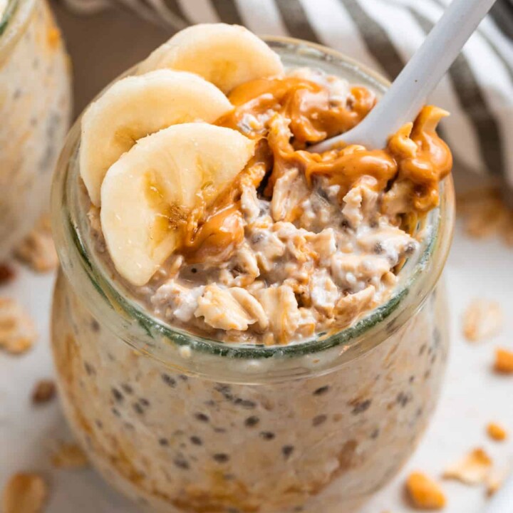 jar of overnight protein oats with bananas and nut butter.