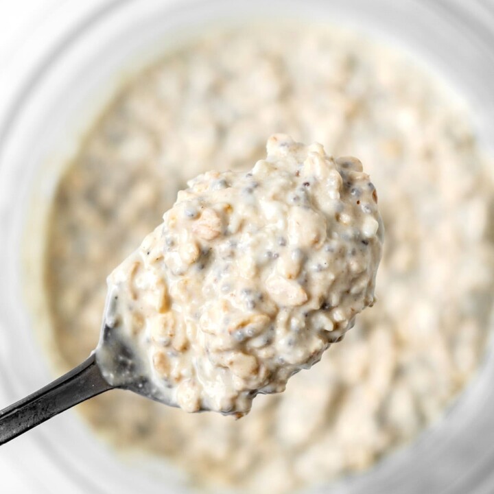 spoonful of cottage cheese overnight protein oats being pulled from the bowl.