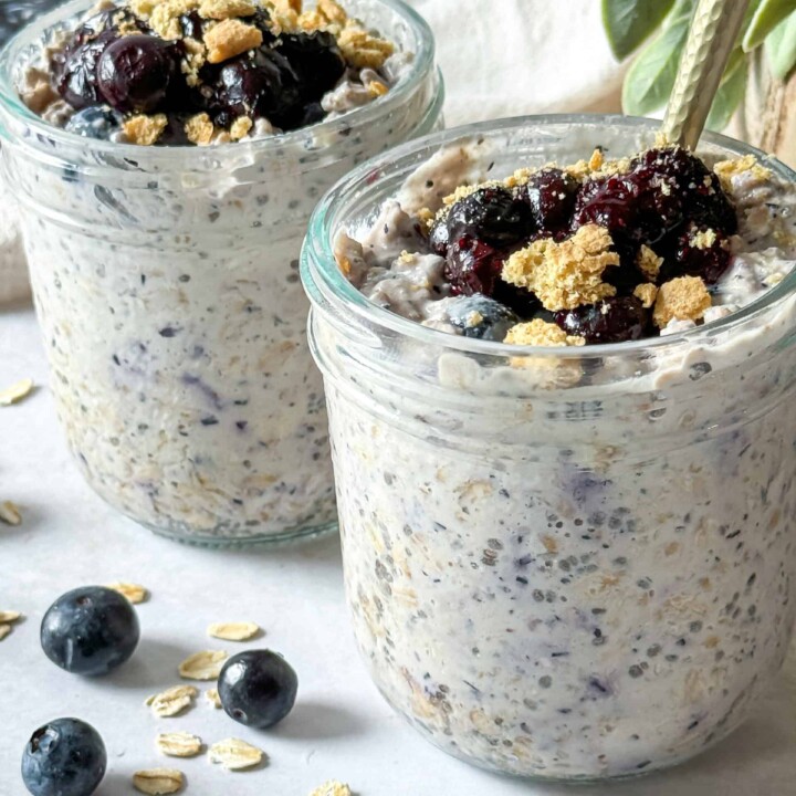 two jars of blueberry cheesecake overnight protein oats.