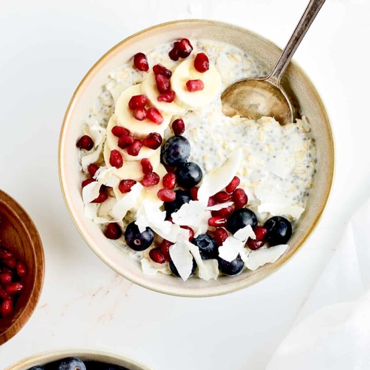 vanilla overnight protein oats with fruit in a bowl.