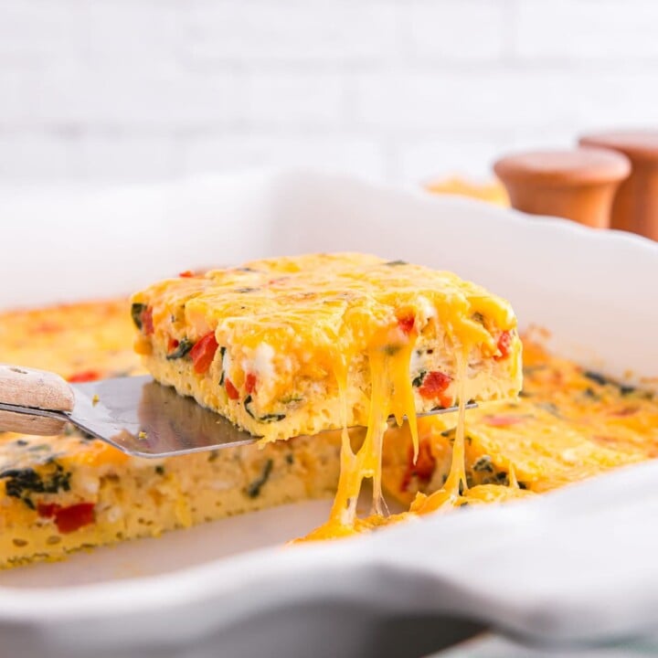 piece of egg bake being pulled from the pan.