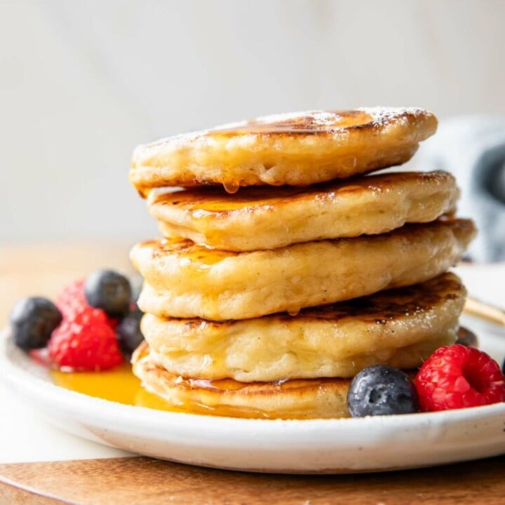 stacked pancakes with berries.