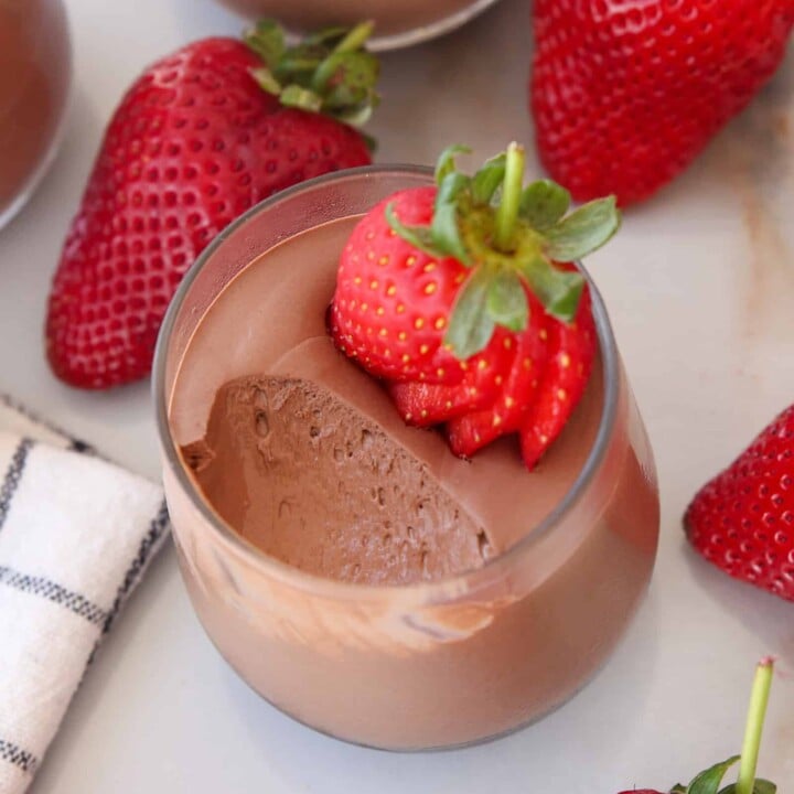 cups of chocolate mousse with strawberries.