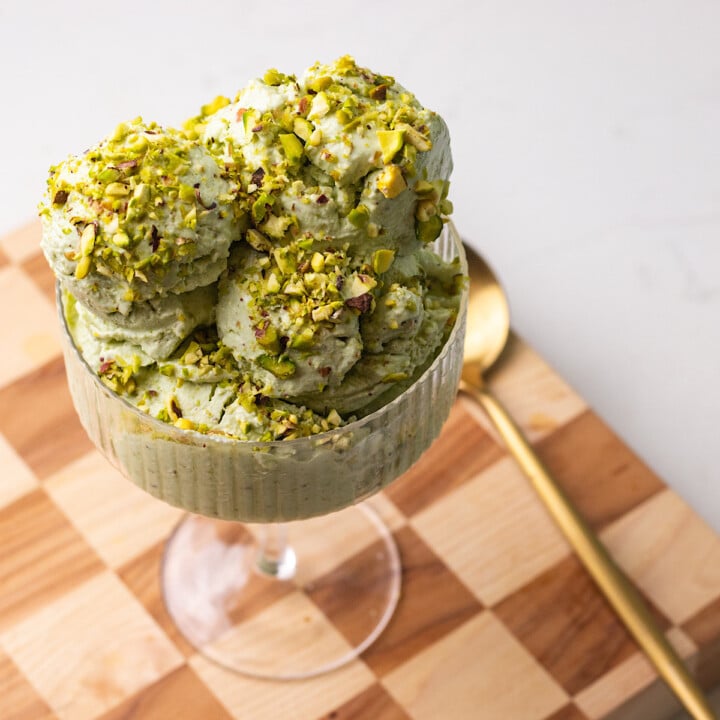 pistachio cottage cheese ice cream in a glass serving dish.
