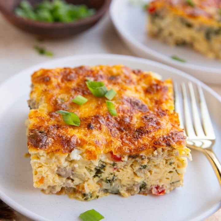 piece of egg bake on a plate with a fork.