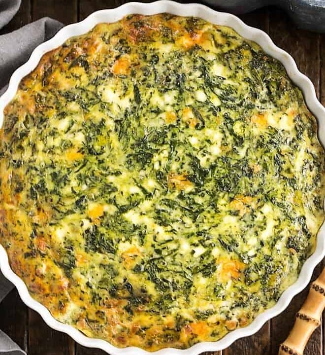 spinach souffle in a ceramic pie dish.