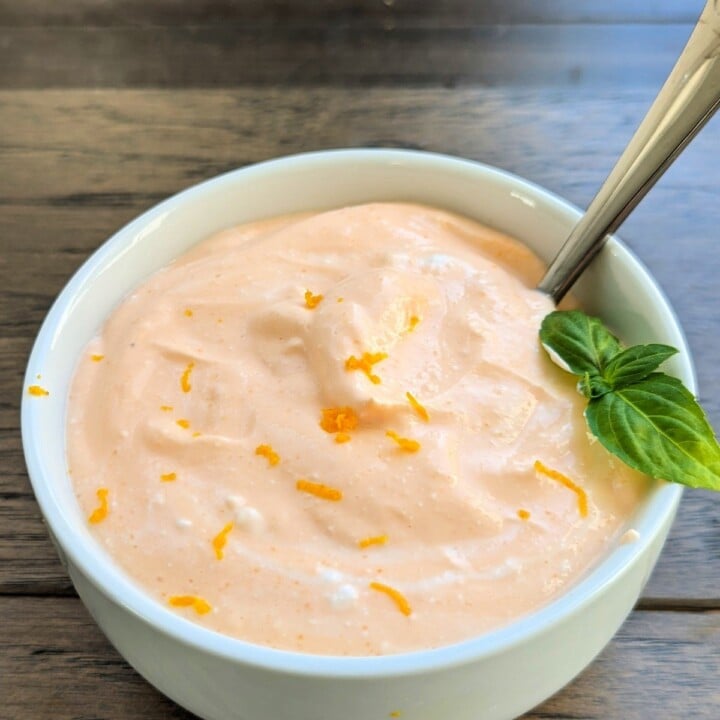 bowl with orange creamsicle flavored jello cottage cheese.