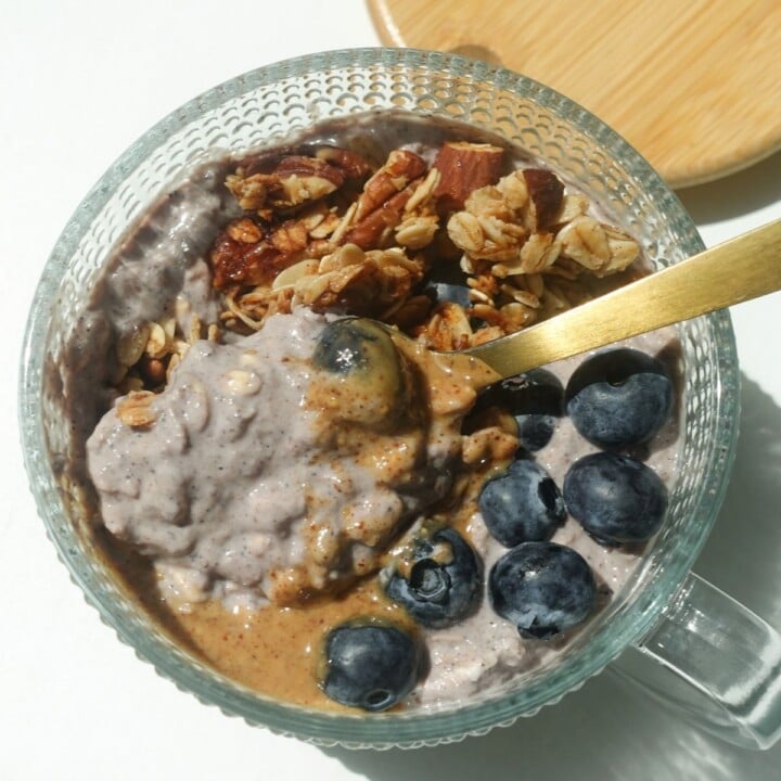 bowl of overnight oats with berries and nuts.
