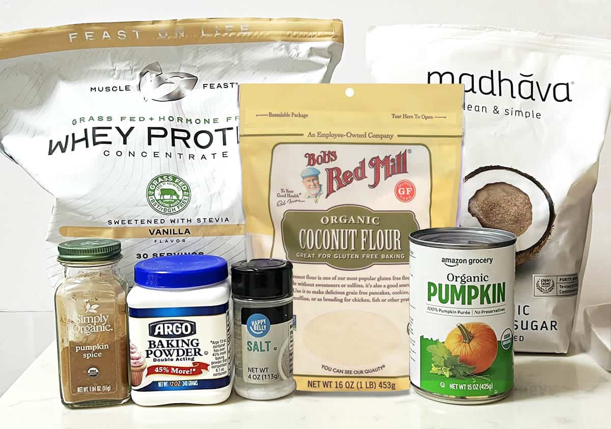 ingredients for protein pumpkin cookies in their packages on a kitchen counter.