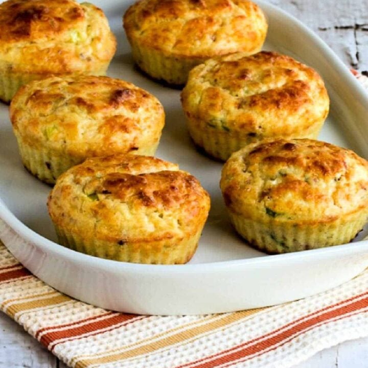 6 cottage cheese breakfast muffins on a white serving plate.
