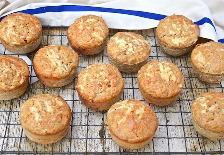 cheese apple muffins on a cooling rack.