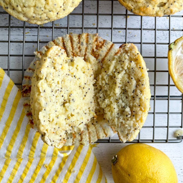 lemon poppy seed protein muffin sliced open on a cooling rack.