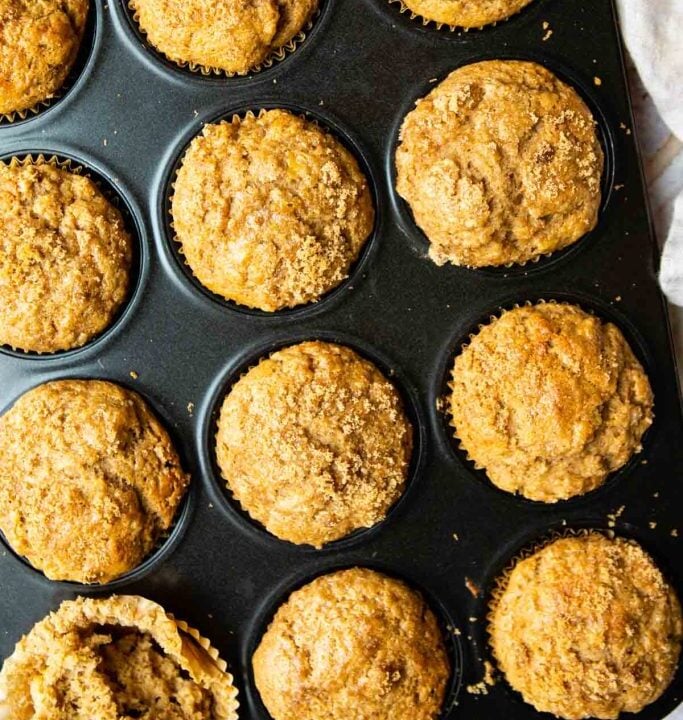 banana protein muffins in a muffin tray.
