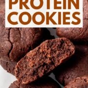 chewy chocolate protein cookies in a glass meal prep container, with text overlay.