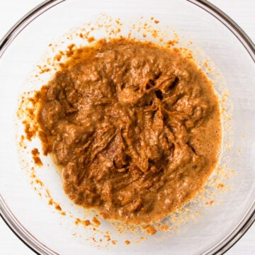 almond butter and water mixed together in a glass bowl.