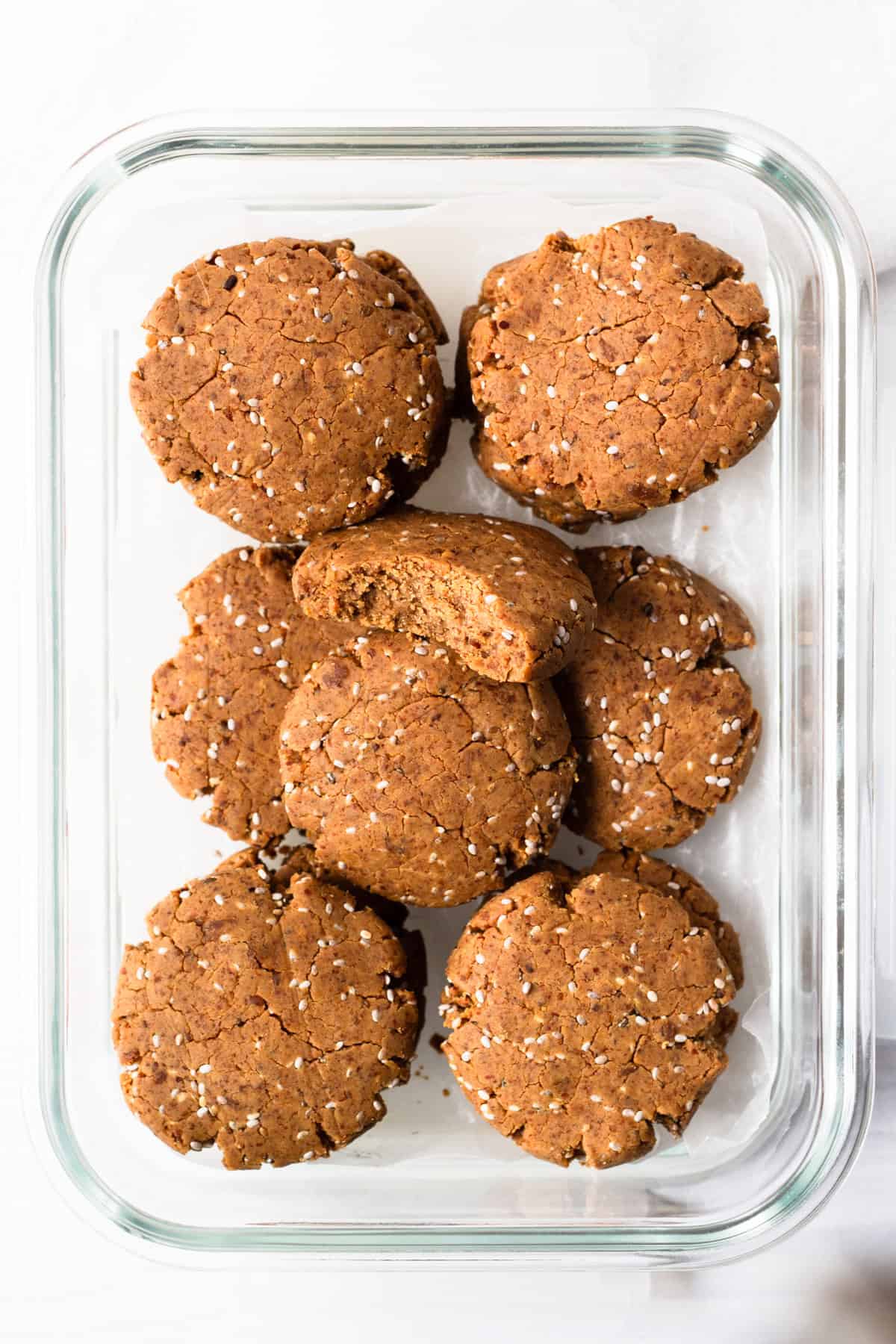 chia almond plant-based protein cookies in a glass meal prep container.