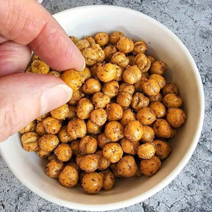 Crunchy roasted chickpeas seasoned with spices, perfect healthy snack.