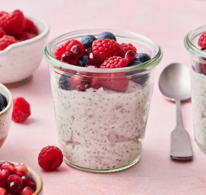 Delicious high-protein berry chia pudding with fresh raspberries and blueberries, perfect for healthy snacks.