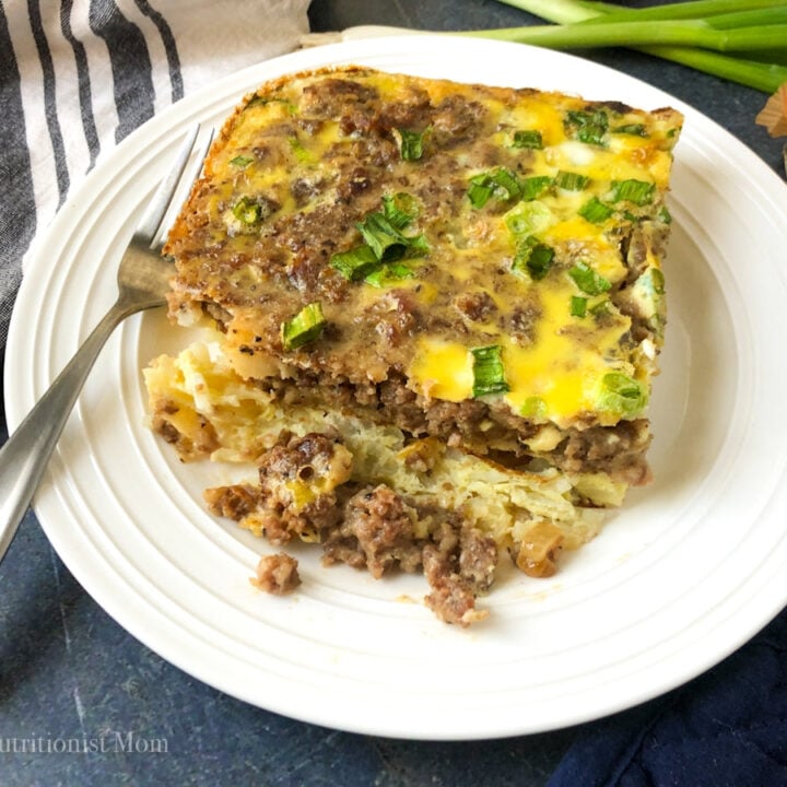piece of high protein sausage egg casserole on a plate with a fork.