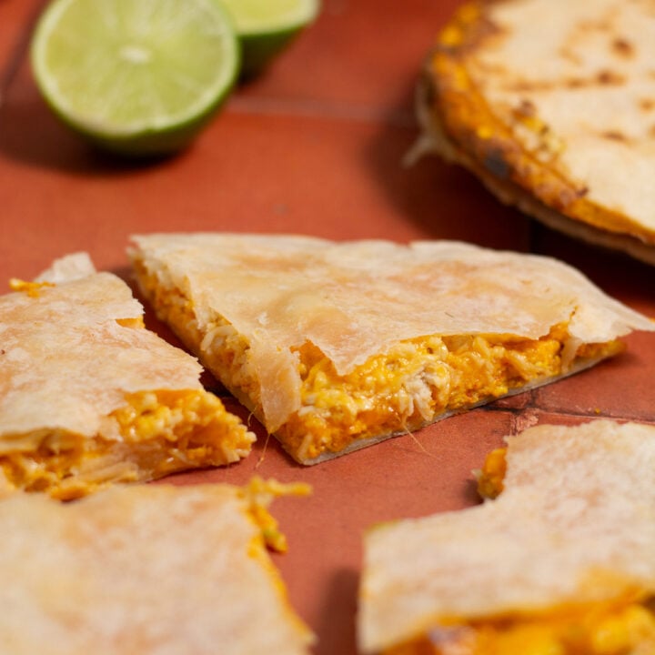 breakfast quesadilla cut into four pieces.