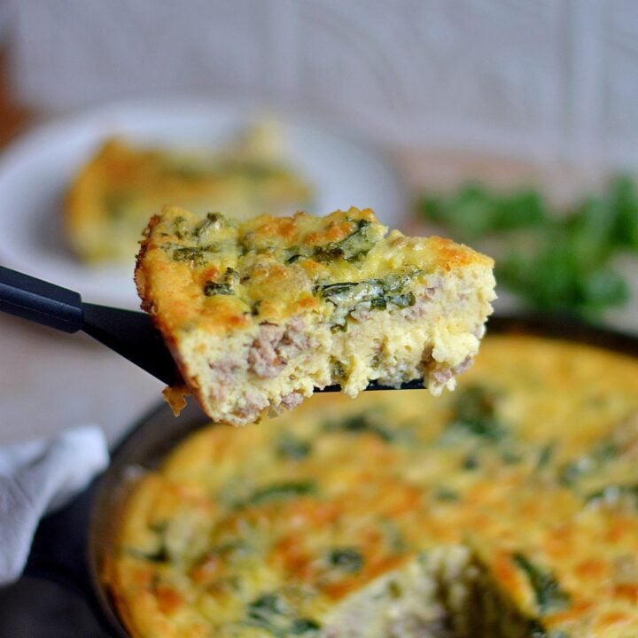 piece of turkey kale egg bake being pulled from the pan.