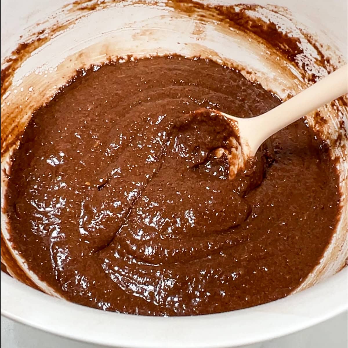 protein brownie batter in a bowl, after the protein has hydrated.