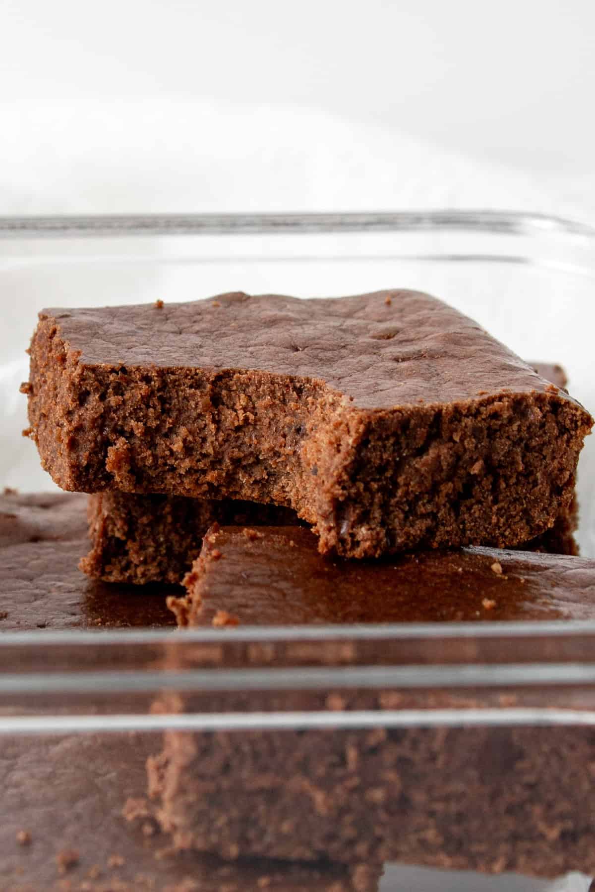 whey protein brownies in a glass meal prep container.