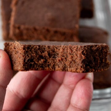 whey protein brownie, bitten, in hand.
